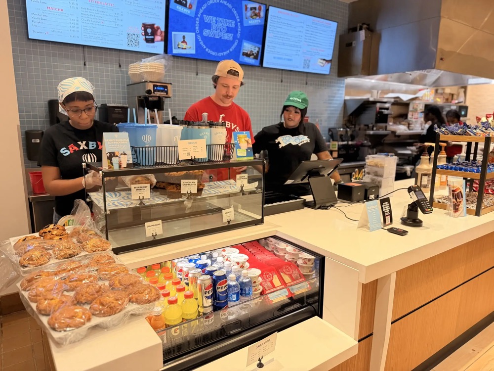 Students working behind the counter at VCU’s Saxbys cafe